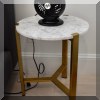 F34. Marble top side table. 